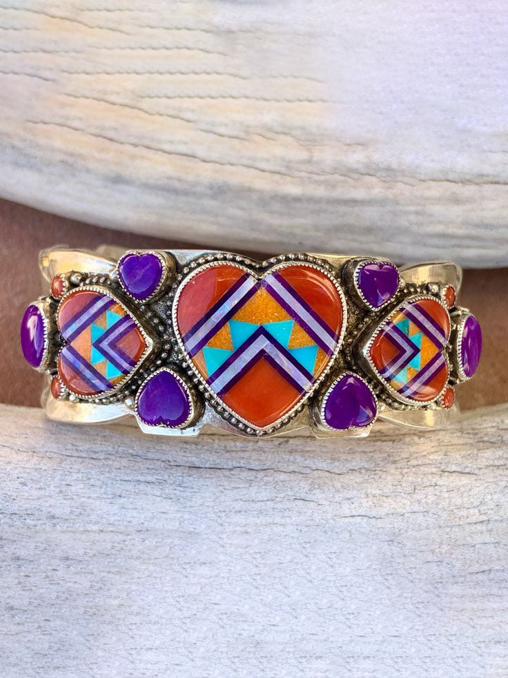 aldrich art jewelry sterling silver bracelet with inlay orange spiney oyster sugilite opal gaspeite turquoise oval center stone and peridot and carnelian accents